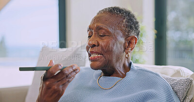Buy stock photo Speaker, online and old woman with phone in lounge, talk and communication with contact on website. Retirement, home and senior black person with mobile, message and chatting with social media app