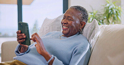 Buy stock photo Texting, online and old woman with phone in lounge, laugh and communication with contact on website. Retirement, home and senior black person with mobile, happiness and chat with social media app