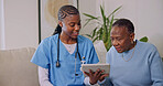 Tablet, caregiver and senior woman in home for consulting, telehealth app or help for medical report. Healthcare, retirement and nurse with African patient for support, wellness and assisted living
