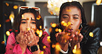 Happy, women and blowing with confetti for new year celebration, event or indoor party together. Portrait, female people or friends with glitter for social gathering, weekend festival or holiday