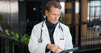 Buy stock photo Mature, man and doctor with tablet in hospital for medical research, patient history or schedule. Male person, healthcare worker or checking app with technology for information or online appointments