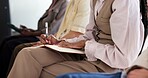 Woman, hands and writing notes in seminar for business training, upskill workshop and learning. Employee, notebook and audience in conference for information, event and advice for career development