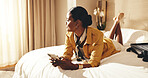 Woman, relax and thinking in hotel room with phone, text message and planning for tourist vacation. Person, reflection and chill in accommodation with tech, internet connection or travel for holiday.