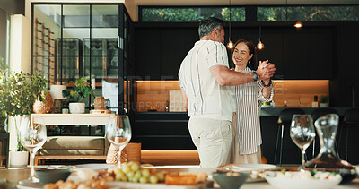 Buy stock photo Care, dance and mature couple in home for romantic commitment, holding hands and smile together. Happy man, woman and moving to music for marriage connection, partner support and love at dinner