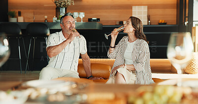 Buy stock photo Drinking, champagne and couple on break, home and bonding with partner in lounge and relax together. Relationship, anniversary and mature people with alcohol, commitment and connection in house
