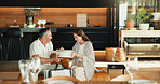 Love, gift giving and mature couple in home, Christmas or gratitude for holiday celebration. Man, woman or appreciation with xmas present exchange, care or bonding together with happy partner on sofa