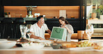Love, gift bag and mature couple in home, laugh and gratitude for anniversary celebration with smile. Man, woman and appreciation with present, care or marriage milestone with funny partner at lunch
