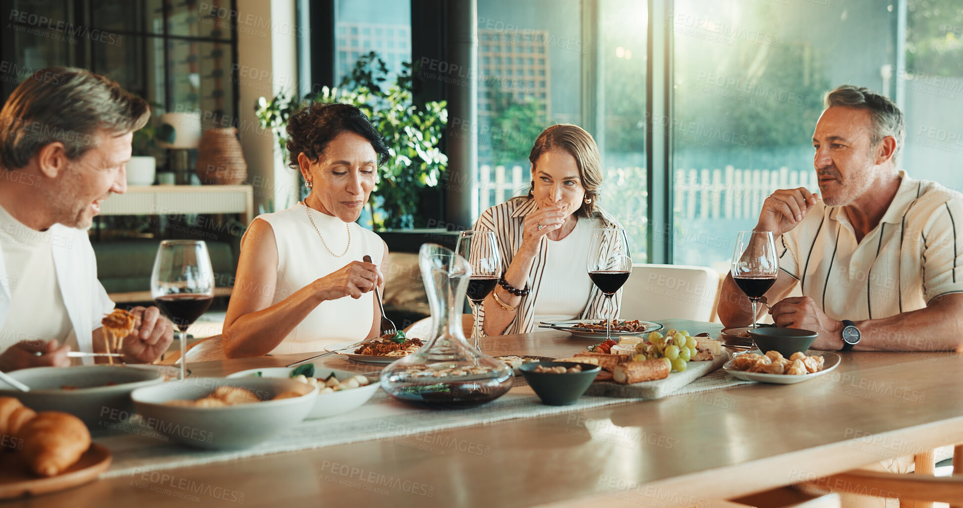 Buy stock photo Celebration, meal or friends in house with smile, bonding together or happy moment with reunion. Wellness, drink or mature people with dinner, party connection or good time with social gathering.