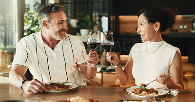 Buy stock photo Couple, food or cheers with wine for love, relationship milestone or anniversary meal in home. Happy man, mature woman and toast with drink for appreciation, marriage care and lunch date with alcohol