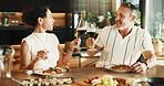 Couple, food or toast with wine for love, relationship milestone or anniversary meal in home. Happy man, mature woman and cheers with drink for appreciation, marriage care and lunch date with alcohol