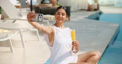 Buy stock photo Selfie, vacation and happy woman with drink in resort for holiday getaway, travel memory or picture. Female person, capture moment or photography with smile or glass by swimming pool for weekend spa