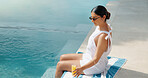 Woman, relax and swimming pool with drink in resort for holiday, travel or summer break in spa. Female person, traveler or beverage with sunglasses by poolside for weekend getaway or trip in retreat