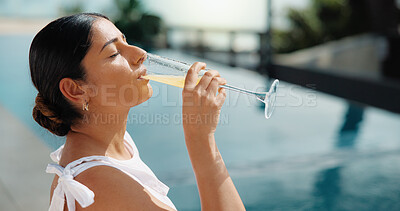 Buy stock photo Woman, relax and vacation with drink by swimming pool for holiday getaway or outdoor summer break. Female person, glass or orange juice for zen, weekend travel or stress relief in luxury resort
