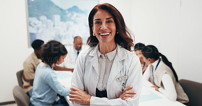 Buy stock photo Healthcare, doctor and woman in meeting with confidence, leadership or career experience in hospital. Mature person, medical expert and happy professional with arms crossed, portrait and laugh