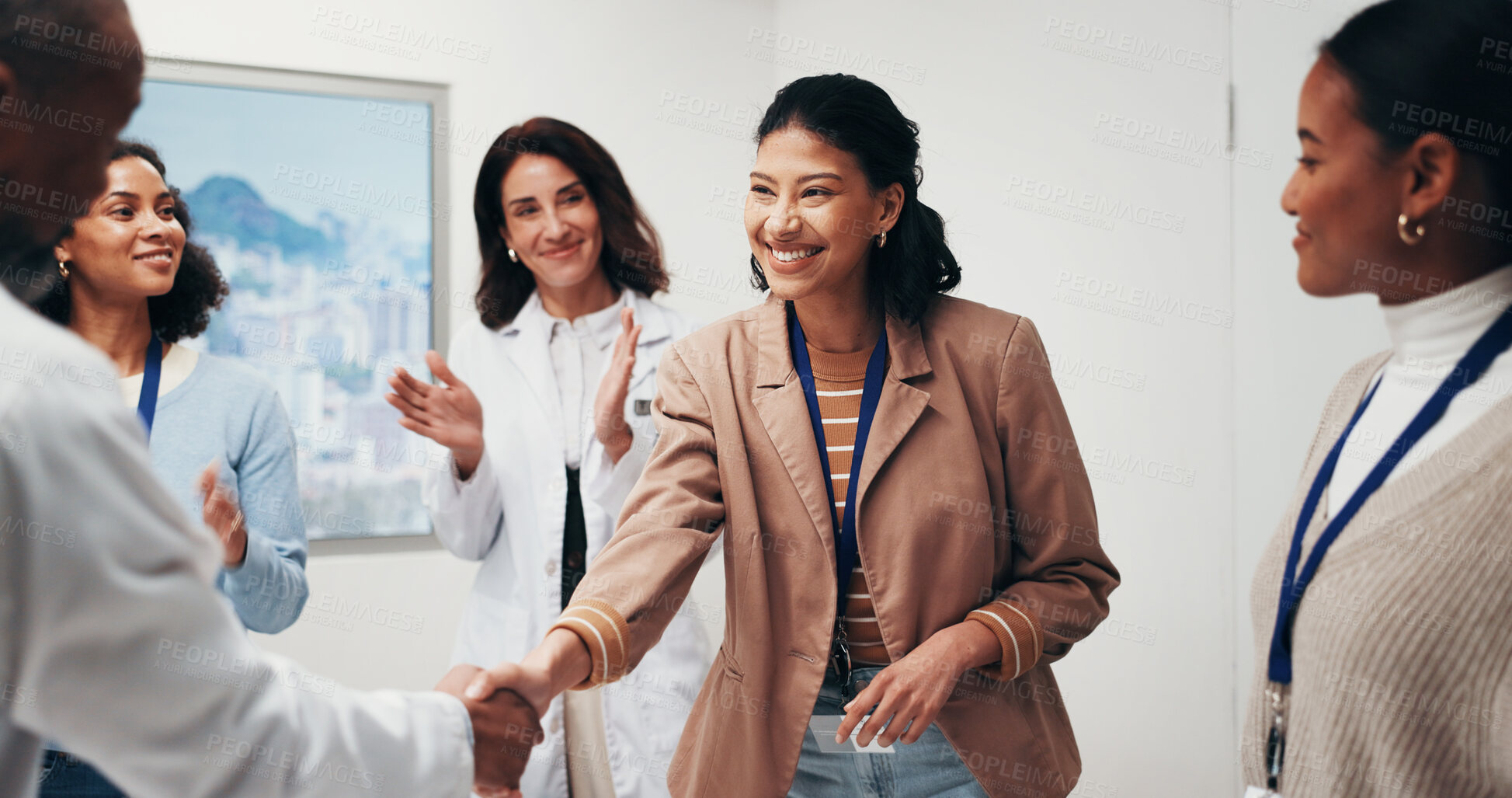 Buy stock photo Doctor, meeting and happy woman with handshake for winning, team success or promotion in hospital. Female person, smile or shaking hands with colleagues or applause for congratulations in clinic