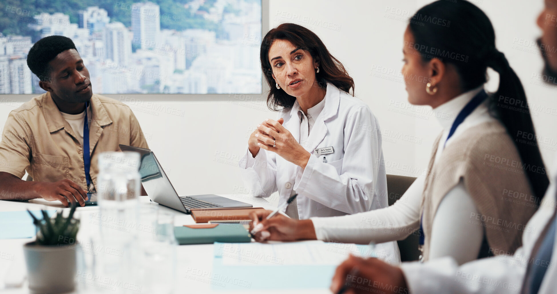 Buy stock photo Doctors, discussion and group with laptop, meeting and health research with colleagues in boardroom. Healthcare, team and people with technology, advice and collaboration with treatment plan on web