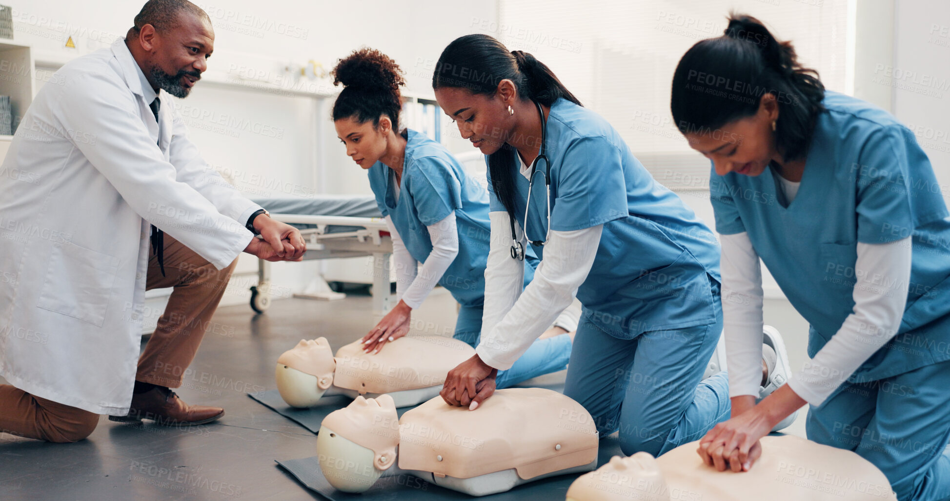 Buy stock photo Doctor, team and mannequin in training for cpr, compression technique and residency practical. Man, physician and resident doctors with dummy, first aid demonstration or simulation for cardiac arrest