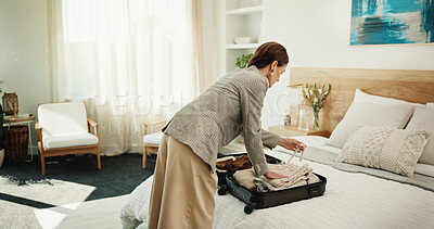 Buy stock photo Woman, packing and suitcase at house for travel, preparation and clothing for holiday adventure. Female person, sorting and luggage in bedroom for tourism, apparel and getting ready for vacation trip