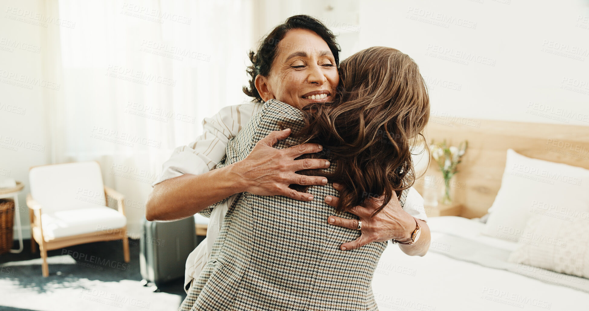 Buy stock photo Visit, greeting and friends in house with embrace, bonding together and excitement with reunion. Space, companion or mature woman in bedroom with hug, friendly welcome or happy moment with connection