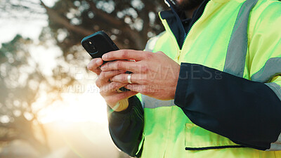 Buy stock photo Construction worker, texting and hands with phone, outdoor or communication with contact on website. Low angle, property development and person with mobile, message and project update on social media