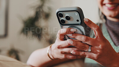 Buy stock photo Woman, hands and relax in home with phone, social media and latest celebrity gossip in online news. Person, mobile and smile in living room for funny article, connectivity and check text notification