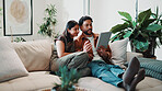 Couple, relax and tablet on sofa for connection, bonding and quality time with streaming or video call. Happy, together and people with digital technology in living room, virtual chat or app at house