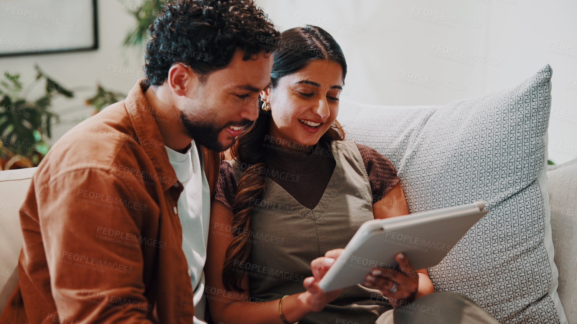Buy stock photo Couple, relax and tablet in home for connectivity, bonding and quality time with streaming. Happy, together and people scroll on sofa with technology, film app or movie choice with connection