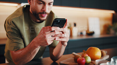 Buy stock photo Recipe, reading or man in kitchen with phone, online instruction or cooking tip in internet search. Digital, nutrition or person in house with tech, food blog or virtual cookbook in culinary activity