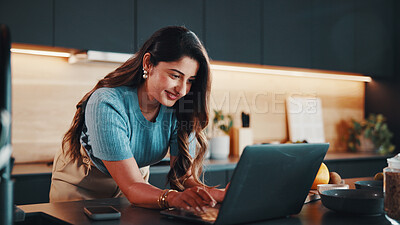 Buy stock photo Businesswoman, smile and remote work in kitchen with laptop, typing email response or administration. Happy, contract worker and person in home with computer, administrator job and morning tasks.