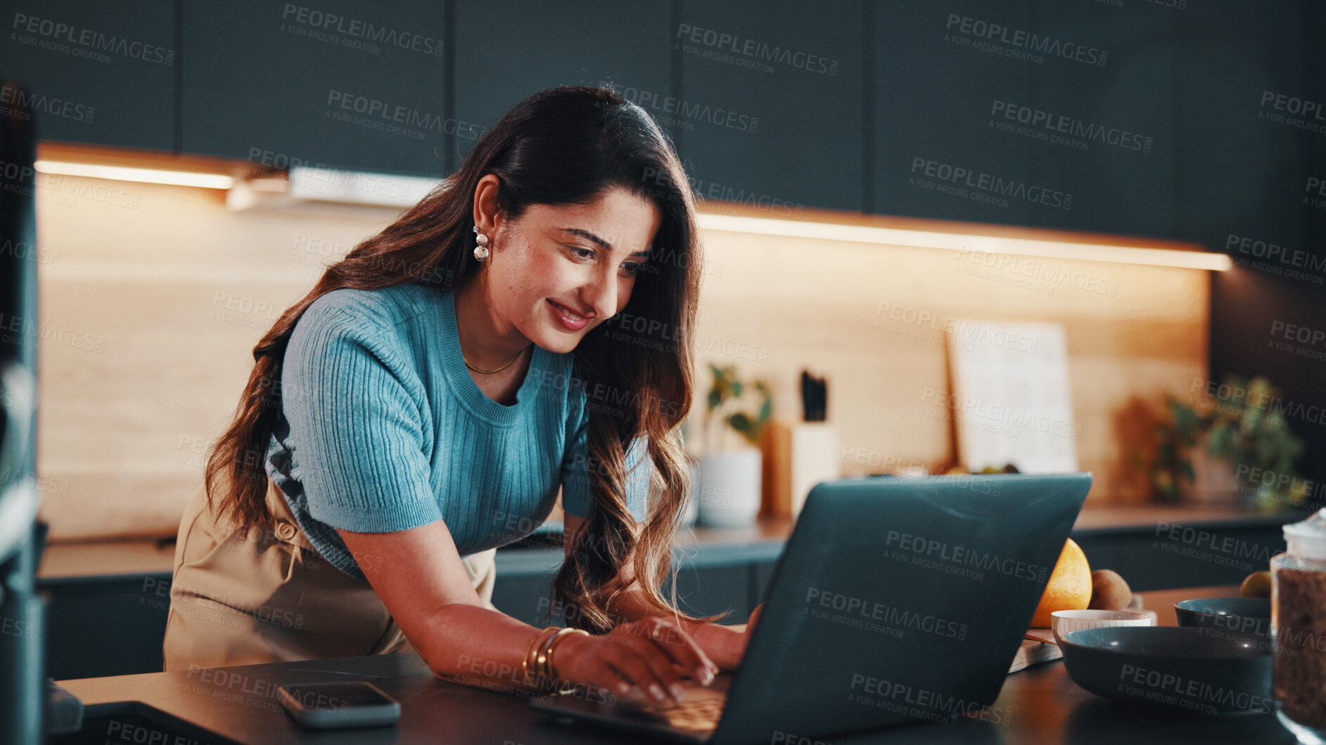 Buy stock photo Businesswoman, smile and remote work in kitchen with laptop, typing email response or administration. Happy, contract worker and person in home with computer, administrator job and morning tasks.
