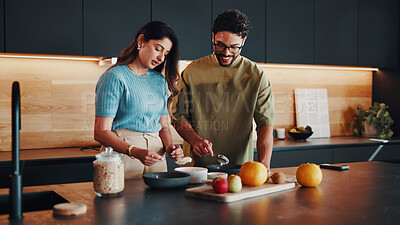 Buy stock photo Couple, breakfast and yogurt in kitchen for health, nutrition or food preparation with happiness. Muesli, man and woman with morning diet in home for help, wellness lifestyle and partner support