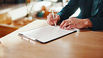 Hands, man and writing at house with contract, signature and lease compliance for real estate. Male person, consent and legal document on table for agreement, property purchase and rental information