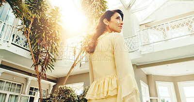 Buy stock photo Thinking, woman and smile at resort for holiday, destination and guest exploring at accommodation. Below, mature person and reflection at retreat for tourism, travel experience and weekend getaway