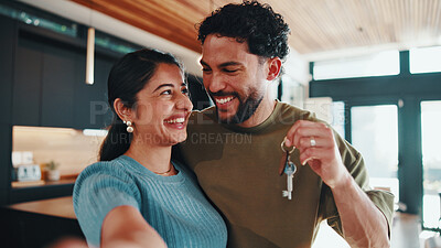 Buy stock photo Couple, selfie and moving in new home with key, smile and social media post for property investment. Happy, married people and photography in dream house with keychain, relocation or memory together.