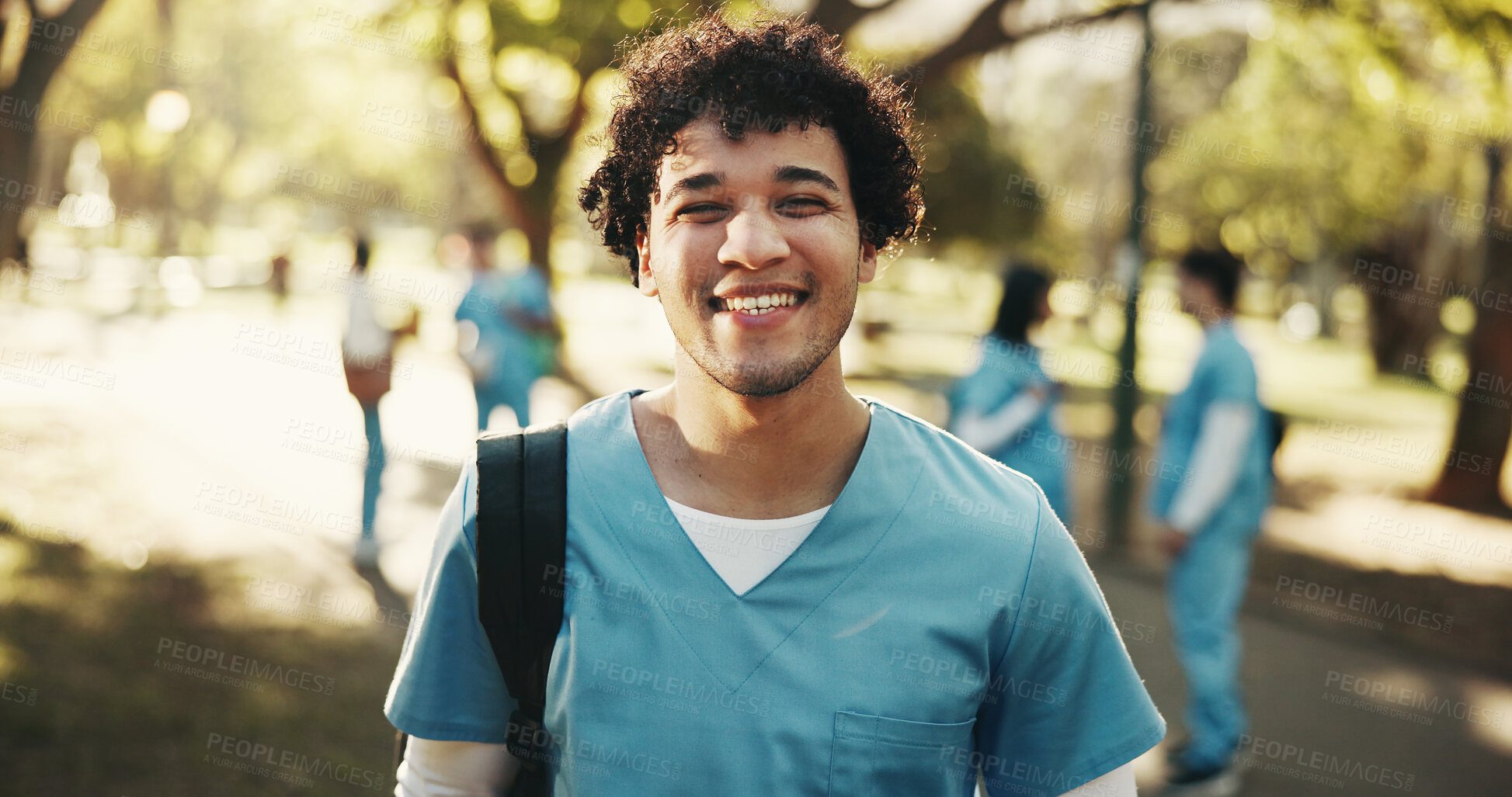Buy stock photo Happy man, nurse and medical student with portrait outdoor for scholarship, development or wellness. Healthcare learner, smile and male person at park, residency and education at nursing school