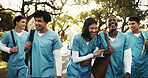 Happy, friends or nursing student outdoor with walk, connection or peer bonding in medical education. Companion, people or interns with laugh, support embrace or group unity in healthcare residency.