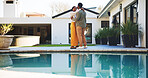 Couple, dancing and happy in backyard by pool for romance, connection and care outdoor with love. Black man, woman and hug for support with rhythm, smile and bonding in relationship by water at house