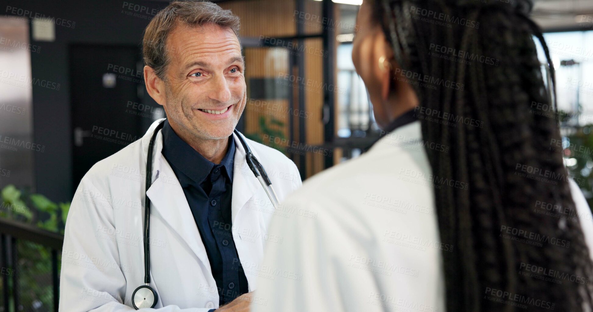Buy stock photo Doctor, man and team in hospital with smile, collaboration and good news for patient rehabilitation. Happy, healthcare manager and people in clinic with positive feedback, medical advice or optimism.