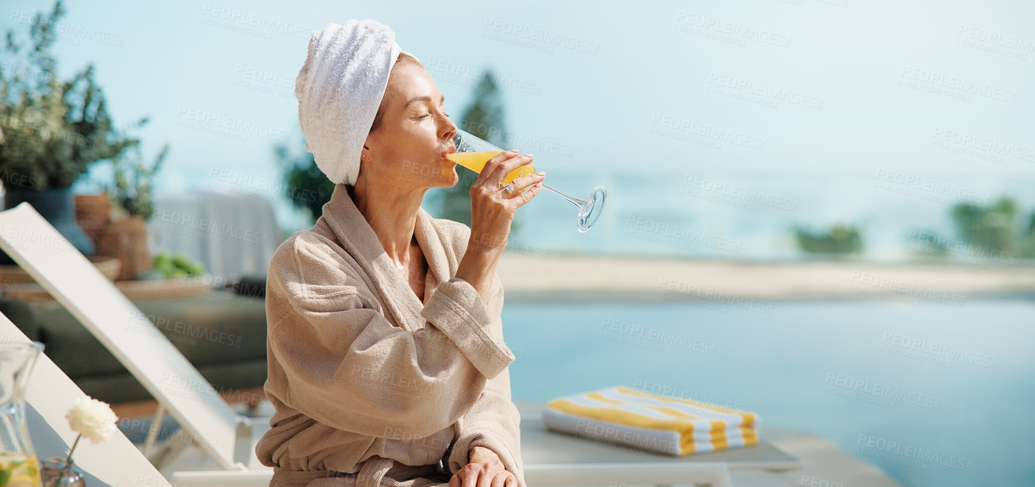 Buy stock photo Relax, hotel and woman with drink by pool for vacation, luxury getaway and holiday on weekend. Hospitality, travel and mature person with mimosa, towel and juice for tourism, peace or break at resort