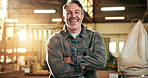 Woodworking, portrait and man with arms crossed in workshop, laughing or artisan with career growth. Manufacturing, carpenter and mature person with pride, happy and furniture production in factory