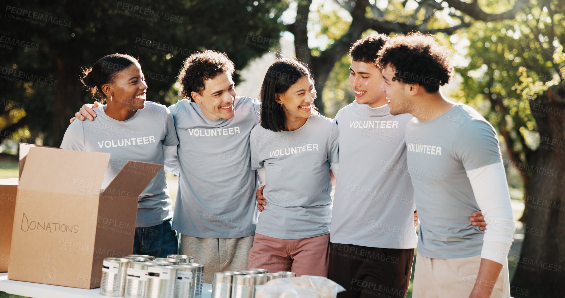 Buy stock photo Volunteers, hug and smile with donations, outdoor and bonding with friends or social responsibility. People, embrace and community service at park, happiness and collaboration for nonprofit project