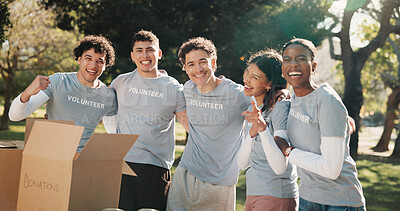 Buy stock photo Volunteer, happy and people with box outdoor for outreach program, community service and welfare. Portrait, park and men with women with parcel for food drive, donation and charity for ngo campaign