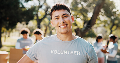 Buy stock photo Volunteer, happy and portrait of man outdoor for outreach program, community service and welfare. Confident, park and person with team for food drive, donation and charity event for ngo campaign