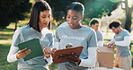 Volunteer, tablet and women with clipboard for planning, talking and grocery checklist for donation. Park, tech and people with team, packages and inventory for food drive, aid and charity outreach