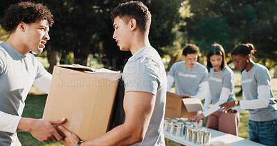 Buy stock photo Volunteer, help and people outdoor with box for charity program, outreach and community service. Collaboration, aid and men with parcel for collection, donation and welfare for food drive in park