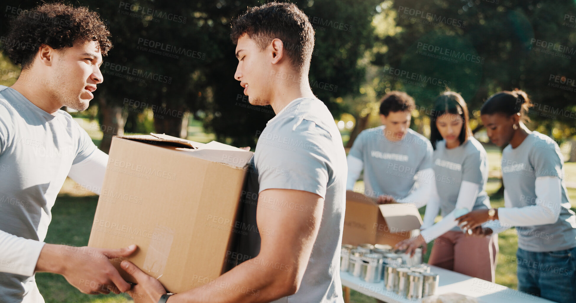 Buy stock photo Volunteer, help and people outdoor with box for charity program, outreach and community service. Collaboration, aid and men with parcel for collection, donation and welfare for food drive in park