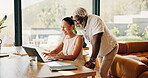 Happy, finance and mature couple on laptop for mortgage, online banking and bills in home. Talking, interracial relationship and man with woman with computer, financial report and budget for savings