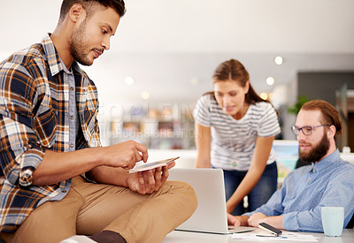 Buy stock photo Tablet, creative and business man in office for logo design, market research and coworking with team. Technology, startup and designer online with app for graphics project, brand and development