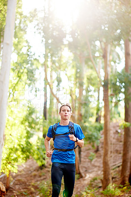 Buy stock photo Running, forest and man in nature for exercise, marathon training and cardio workout outdoor. Sports, runner and person for wellness, performance and health for endurance, challenge and race in woods