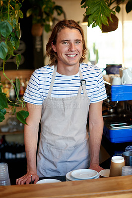Buy stock photo Happy, counter and portrait of man in coffee shop for serving drinks, espresso and beverage. Restaurant barista, hospitality and person with cappuccino, latte and tea for customer service in cafe